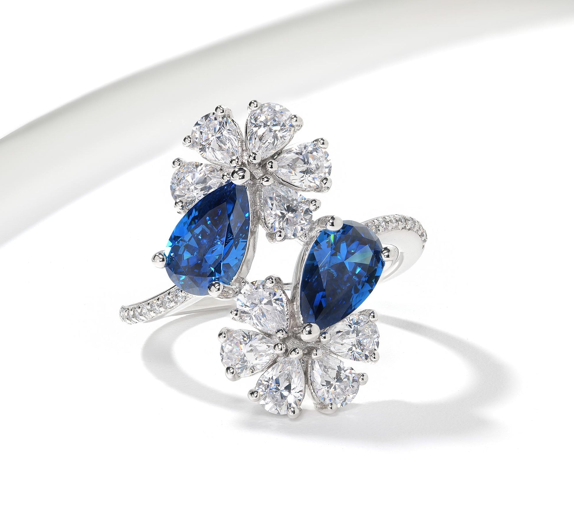 Kathy Levine Sterling Silver White and Sapphire Cubic Zirconia Double Flower Pear and Round Bypass Ring